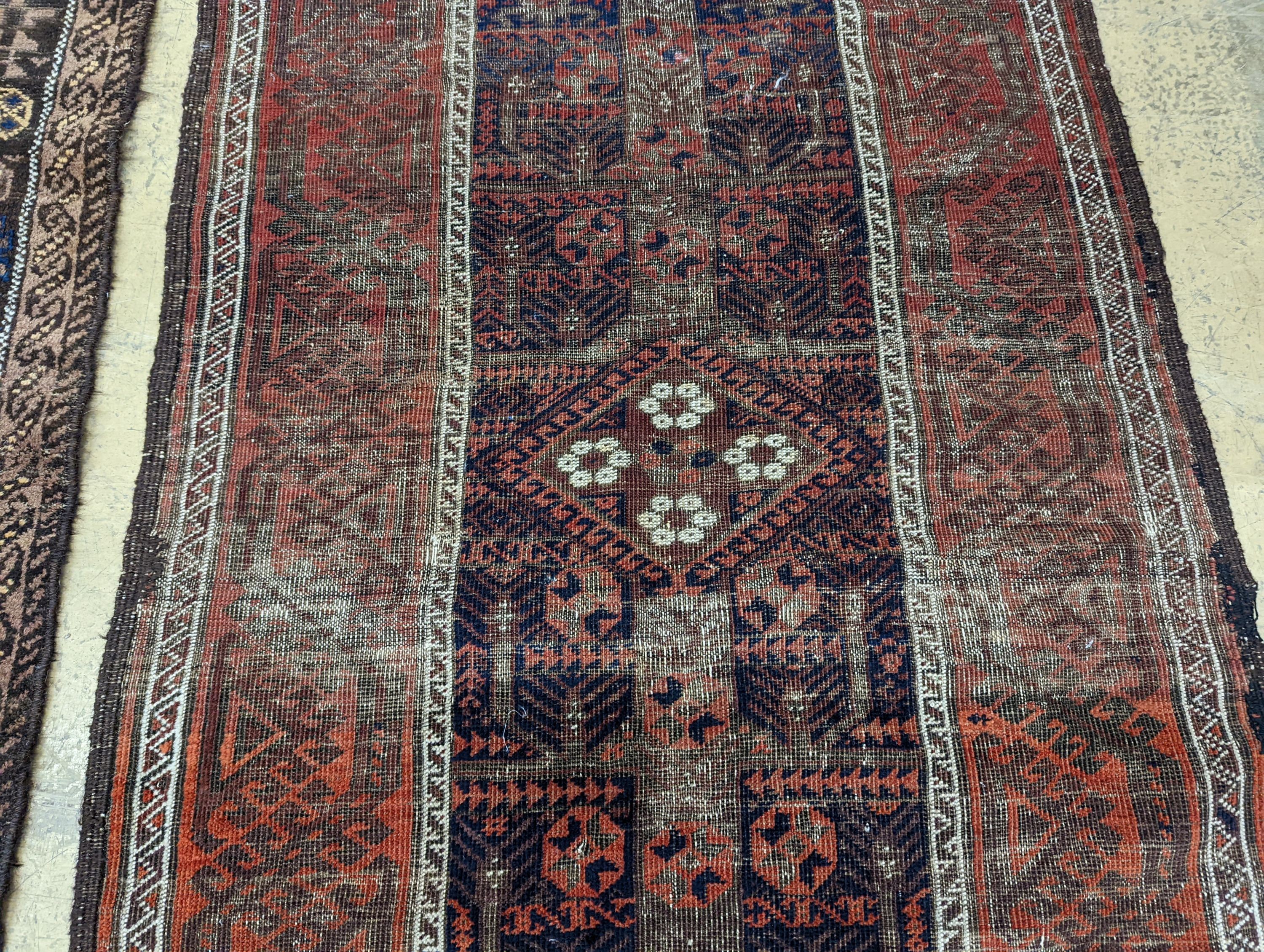 Two Caucasian geometric polychrome rugs, largest 190 x 96cm